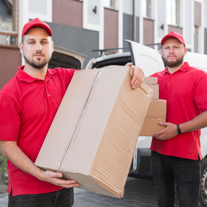 front-view-delivery-man-with-packagaes_23-2148684719